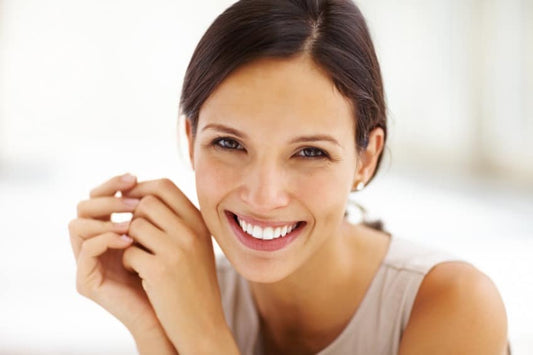 A smiling woman with a pleasant facial expression.